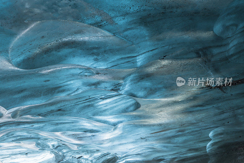 beautiful blue ice wall in an ice cave of the Vatnajökull glacier in Iceland